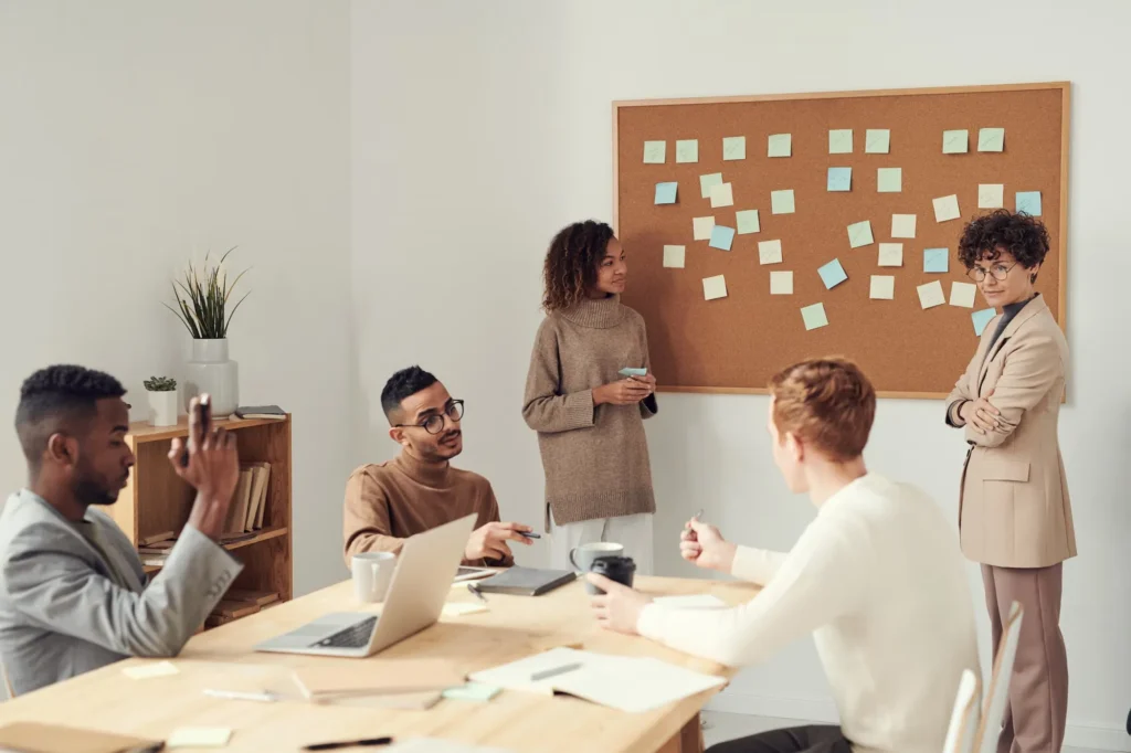Team planning session with sticky notes on a board