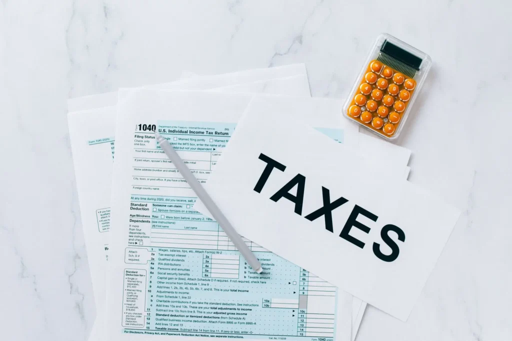 Tax paperwork and calculator on a desk
